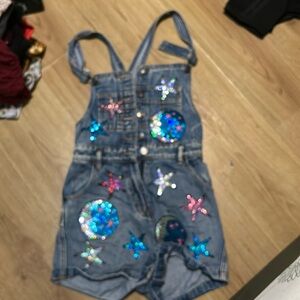 Denim overalls with patches